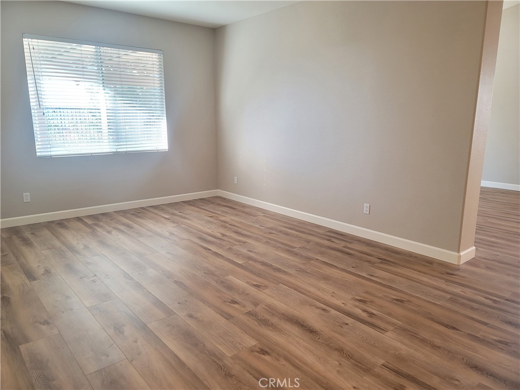 44915 Machon Road Temecula, CA 92592 - Photo 31 of 40 an empty room with wooden floor and windows