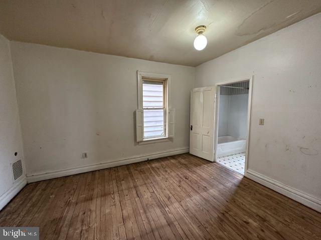 222 2nd Avenue Hanover, PA 17331 - Photo 4 of 10 an empty room with wooden floor and windows