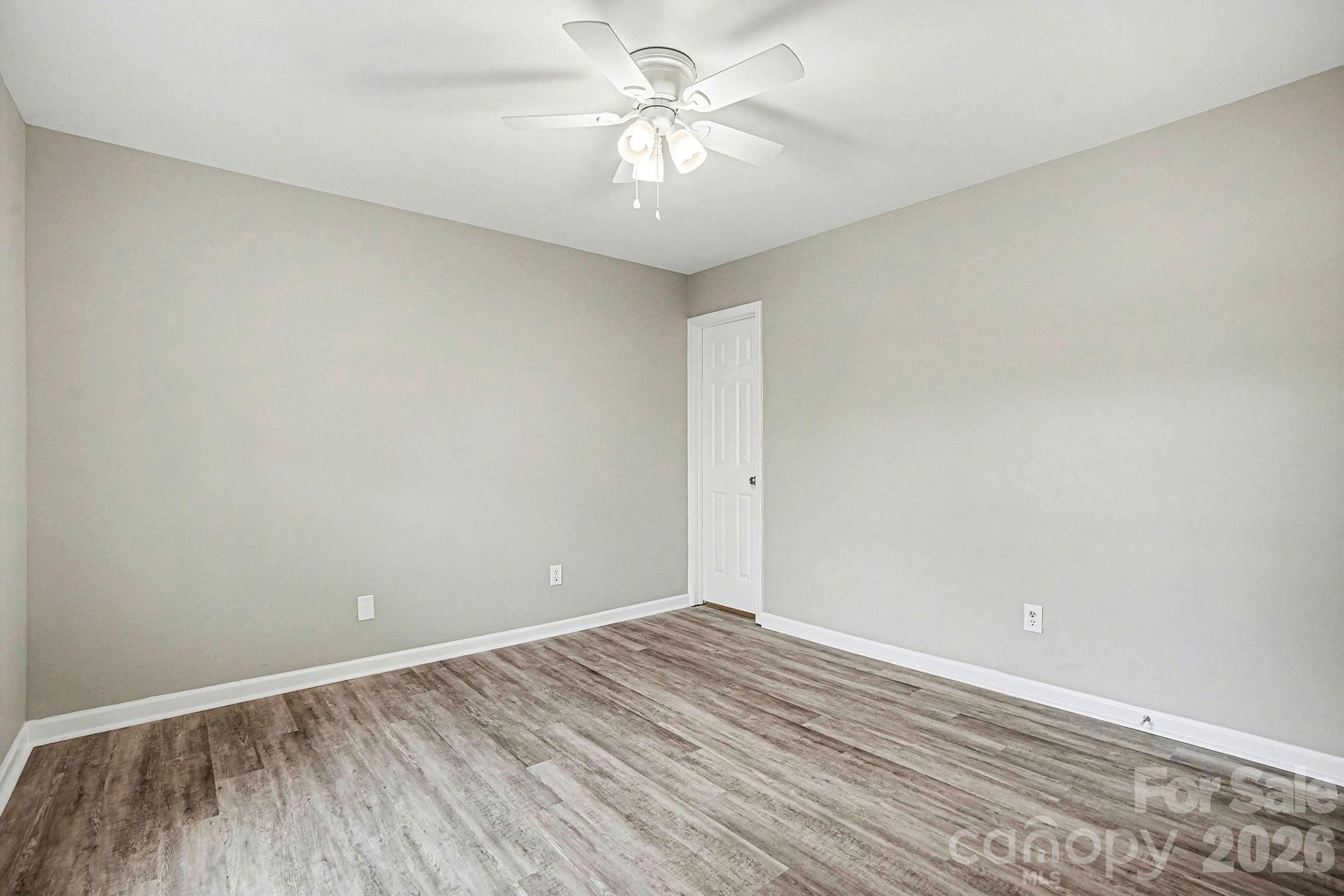 5509 Morgan Mill Road Monroe, NC 28110 - Photo 20 of 33 wooden floor in an empty room