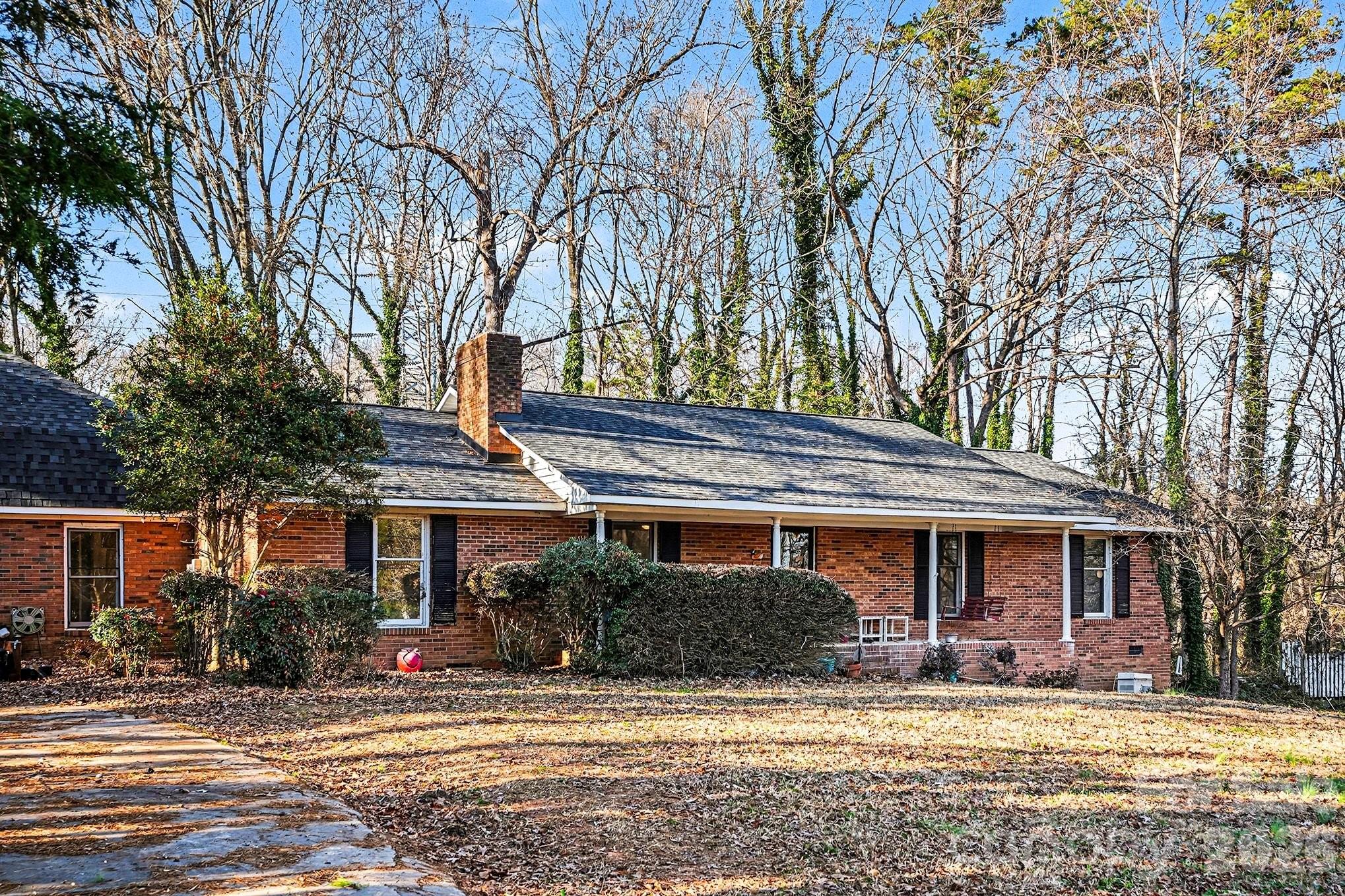5509 Morgan Mill Road Monroe, NC 28110 - Photo 2 of 33 a front view of a house with a yard