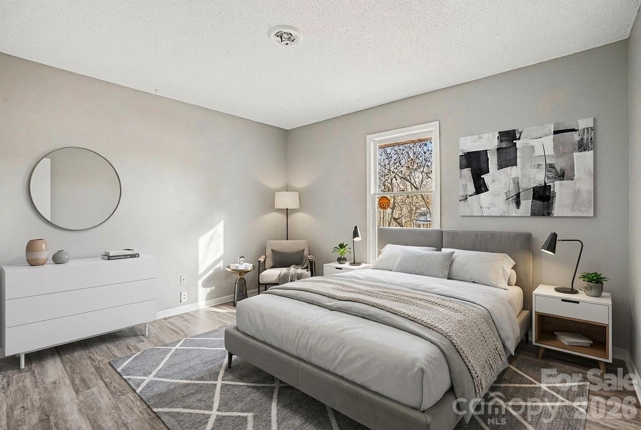 5509 Morgan Mill Road Monroe, NC 28110 - Photo 22 of 33 a bedroom with a bed and a dresser