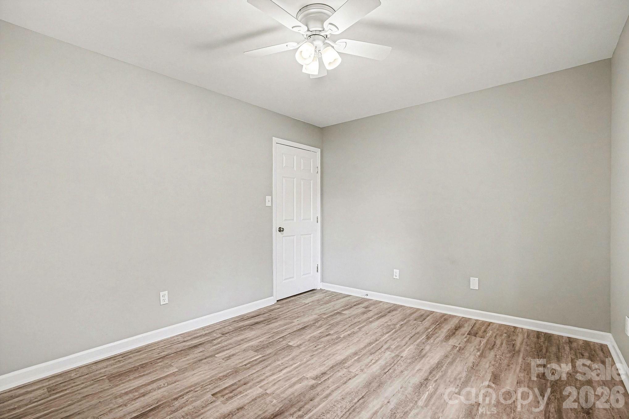 5509 Morgan Mill Road Monroe, NC 28110 - Photo 26 of 33 wooden floor in an empty room
