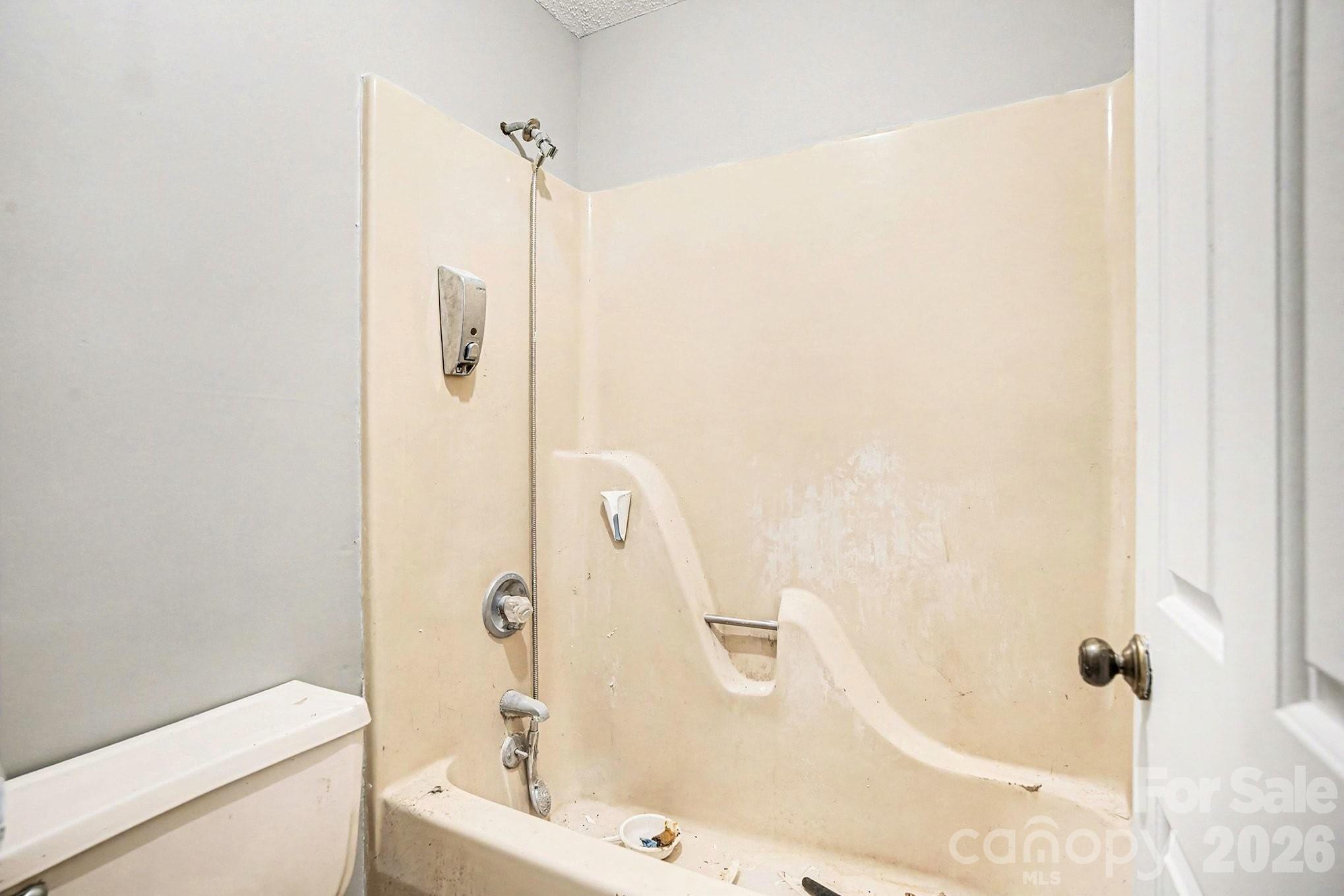 5509 Morgan Mill Road Monroe, NC 28110 - Photo 30 of 33 a bathroom with a bathtub and a shower