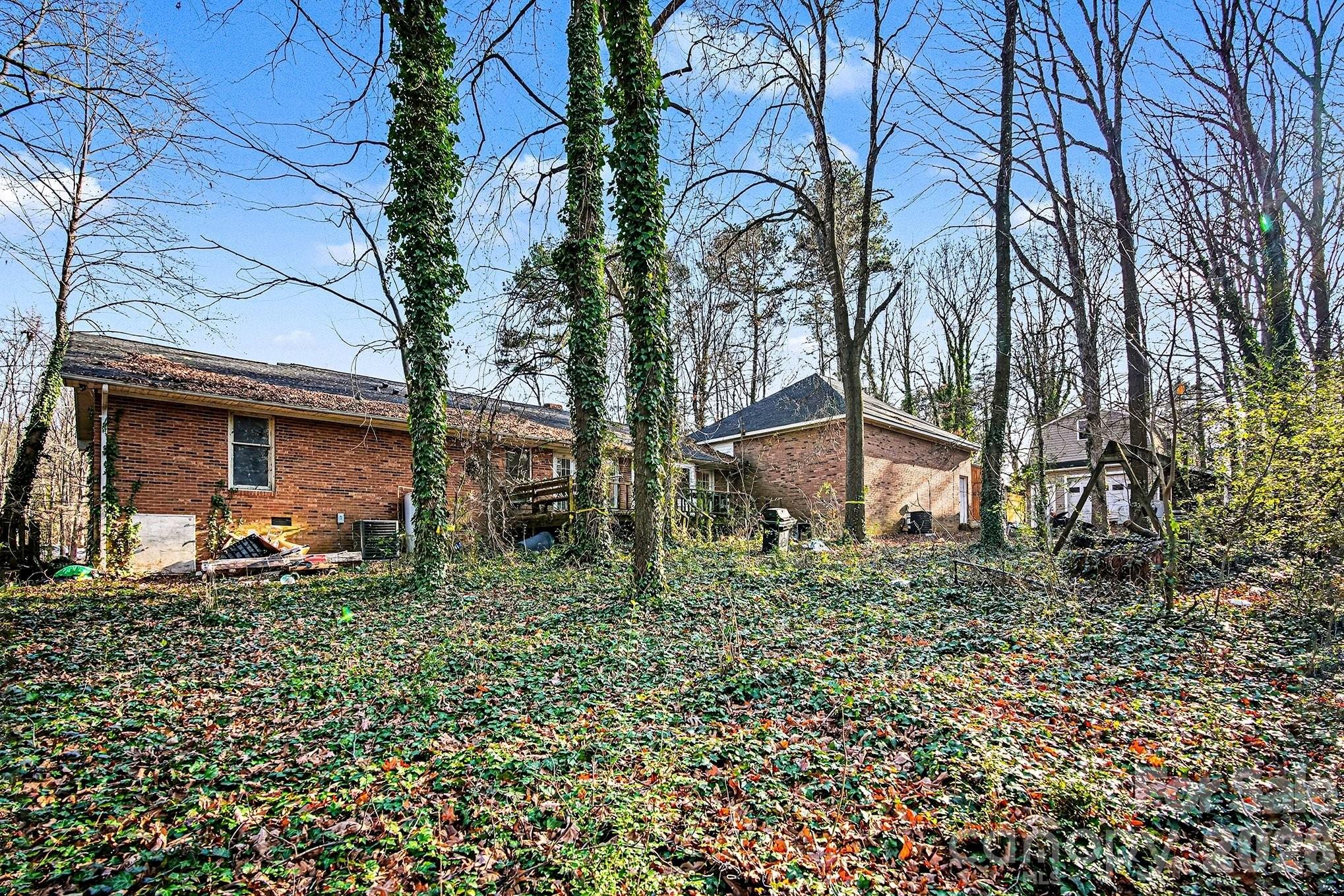 5509 Morgan Mill Road Monroe, NC 28110 - Photo 33 of 33 a backyard of a house with lots of green space