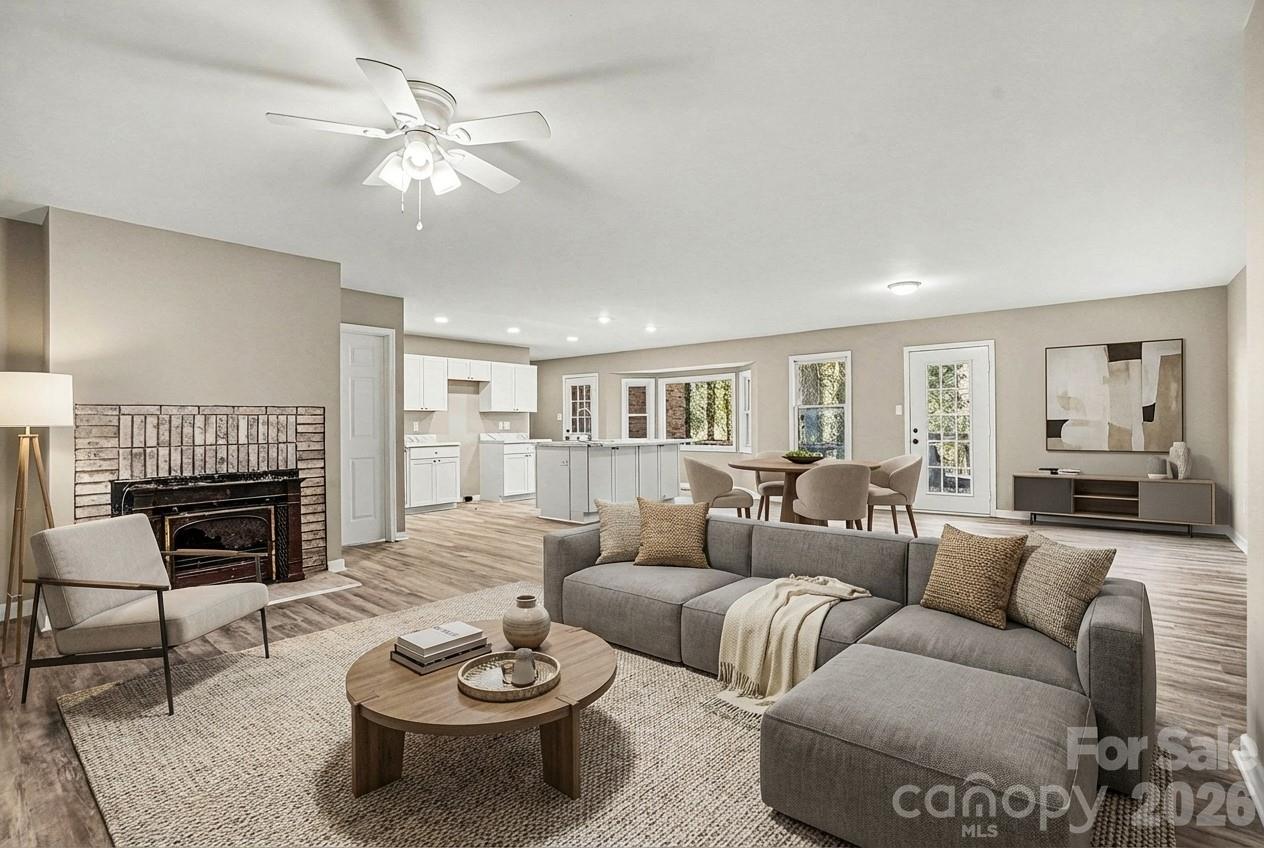 5509 Morgan Mill Road Monroe, NC 28110 - Photo 4 of 33 a living room with furniture and a fireplace