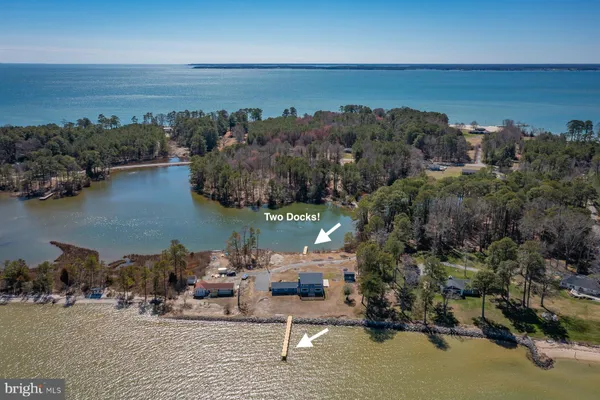 an aerial view of a house with a lake view