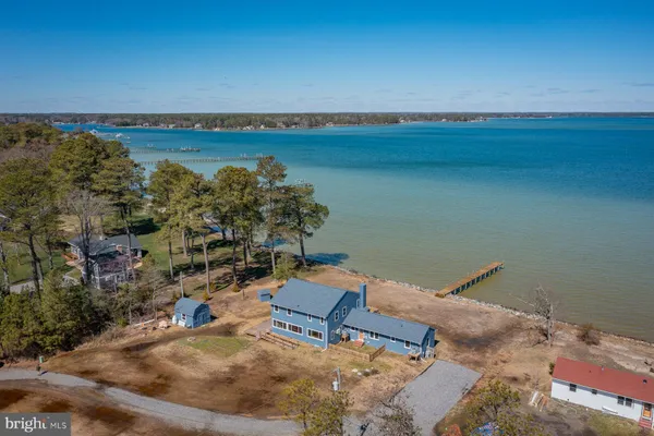 an aerial view of a house with lake view