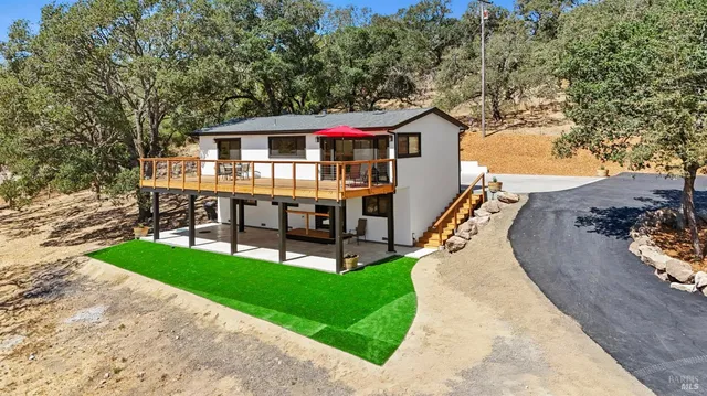 a view of house with outdoor entertaining spaces