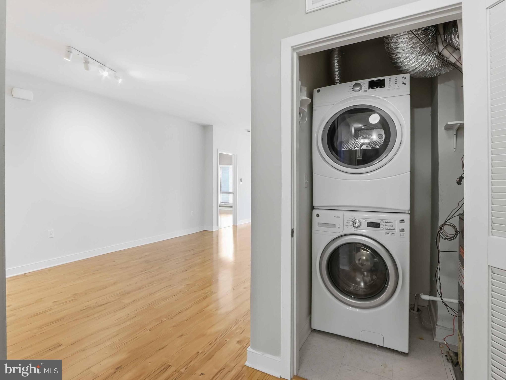 8005 13th Street, Unit 411 Silver Spring, MD 20910 - Photo 19 of 33 a utility room with dryer and washer