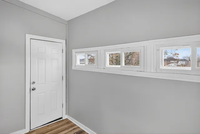 a view of an empty room with a window