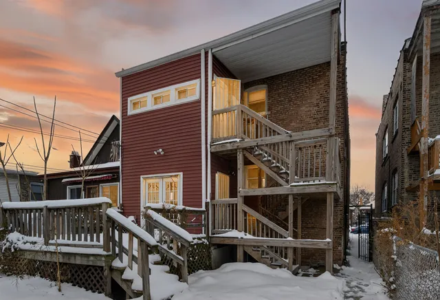 a view of a house with iron stairs