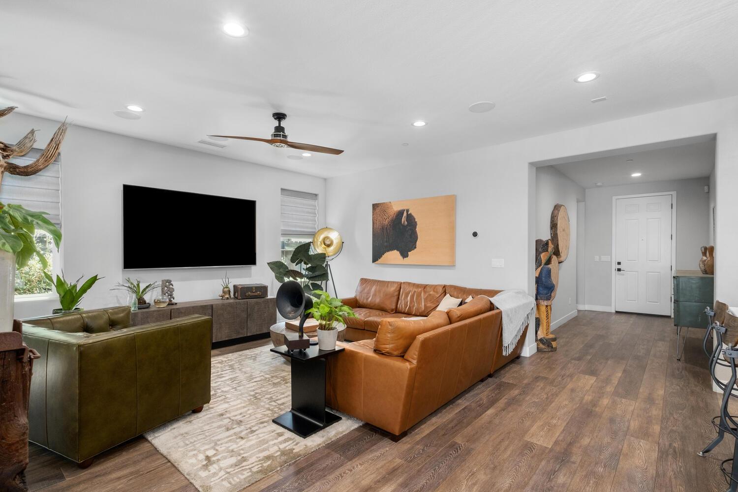 3477 Junipero Avenue Clovis, CA 93619 - Photo 12 of 39 a living room with furniture and a flat screen tv