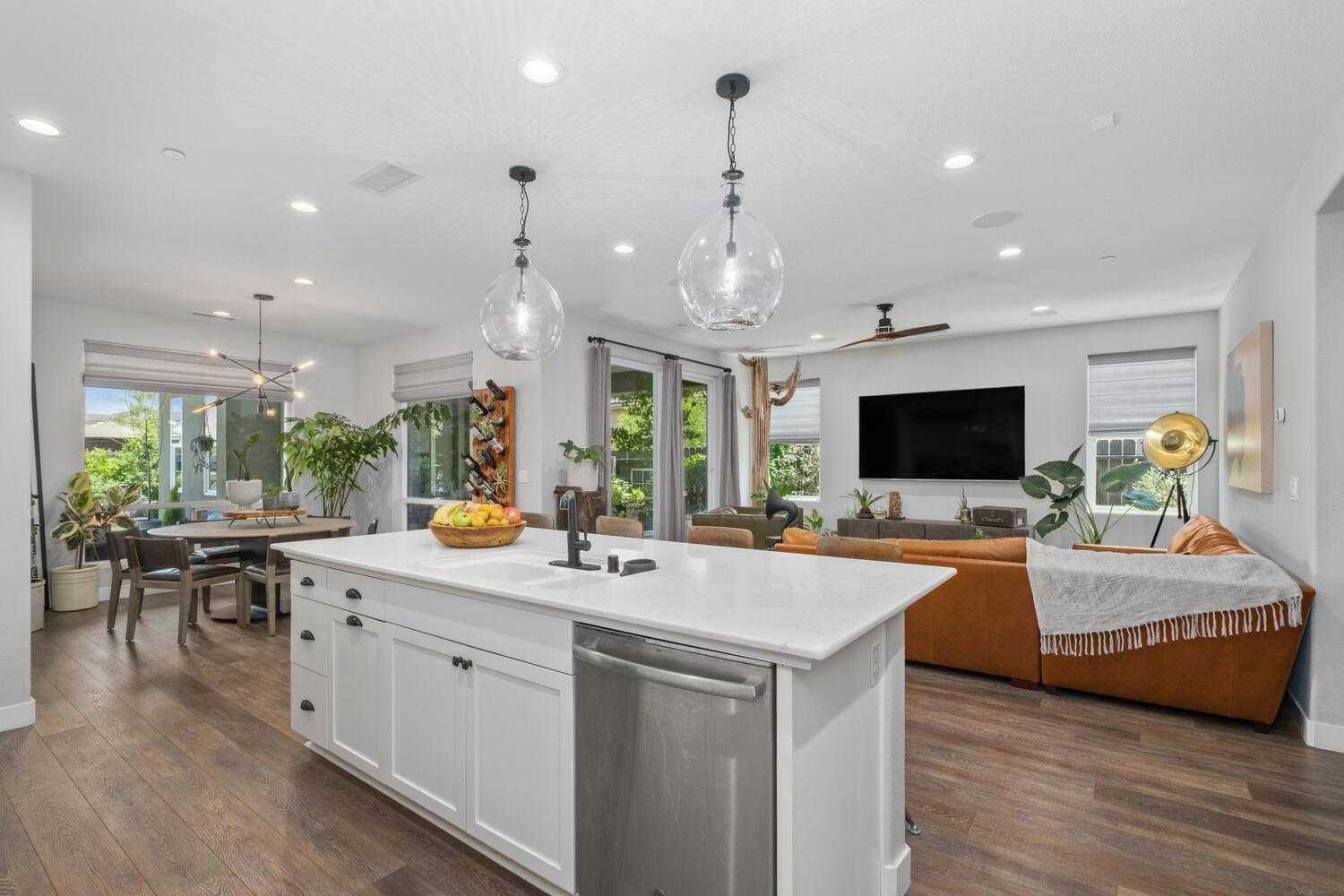 3477 Junipero Avenue Clovis, CA 93619 - Photo 16 of 39 a view of living room kitchen island and stainless steel appliances