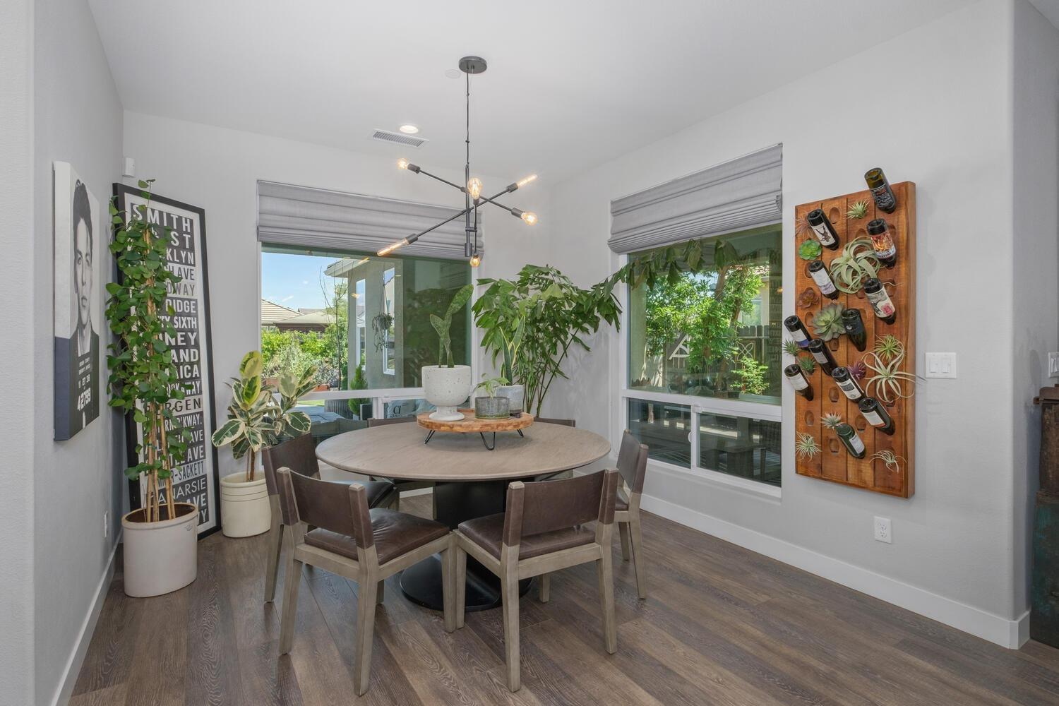 3477 Junipero Avenue Clovis, CA 93619 - Photo 17 of 39 a view of a dining room with furniture window and wooden floor