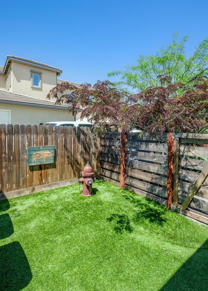 3477 Junipero Avenue Clovis, CA 93619 - Photo 32 of 39 a view of a chairs and table in backyard of the house