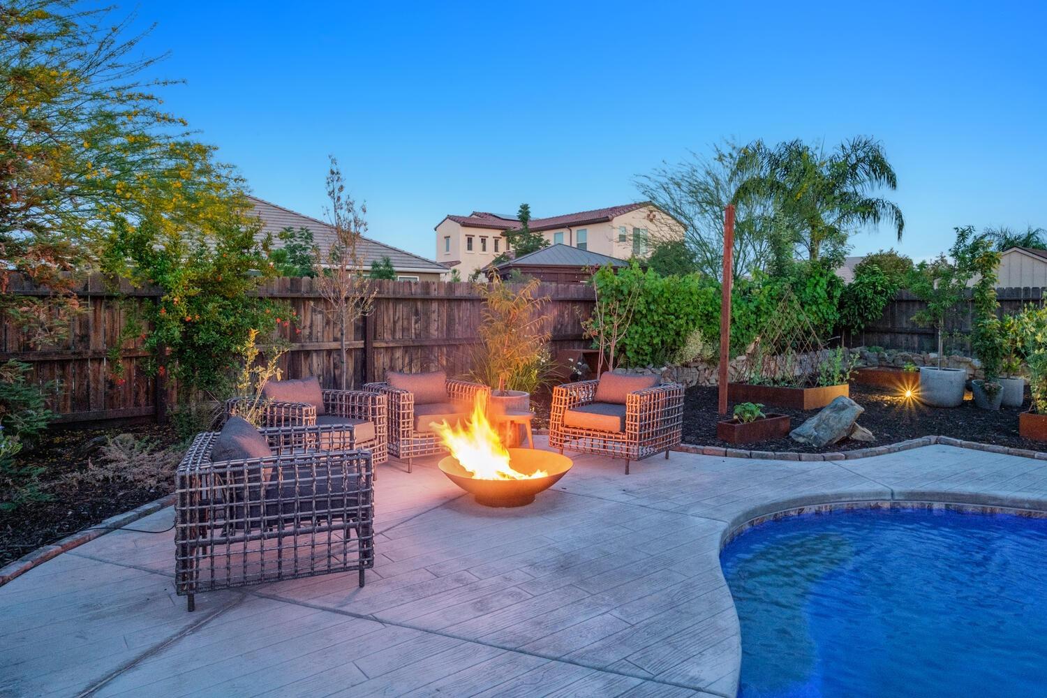 3477 Junipero Avenue Clovis, CA 93619 - Photo 36 of 39 a backyard of a house with barbeque oven table and chairs