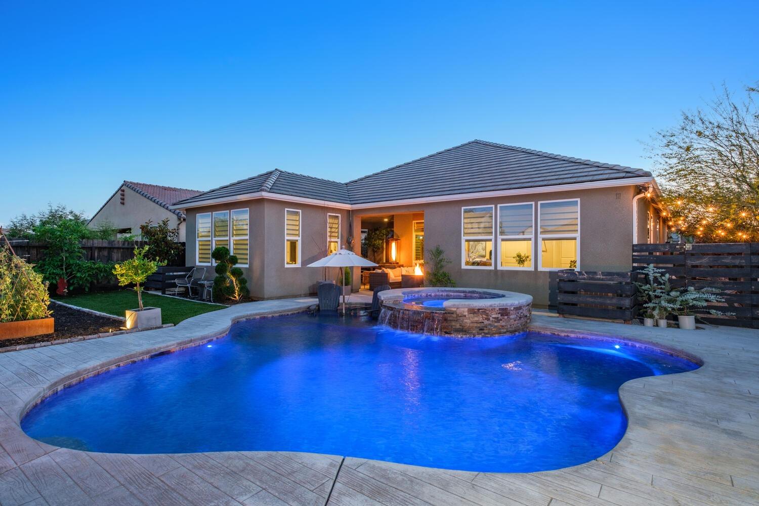3477 Junipero Avenue Clovis, CA 93619 - Photo 37 of 39 a view of a house with swimming pool and sitting area