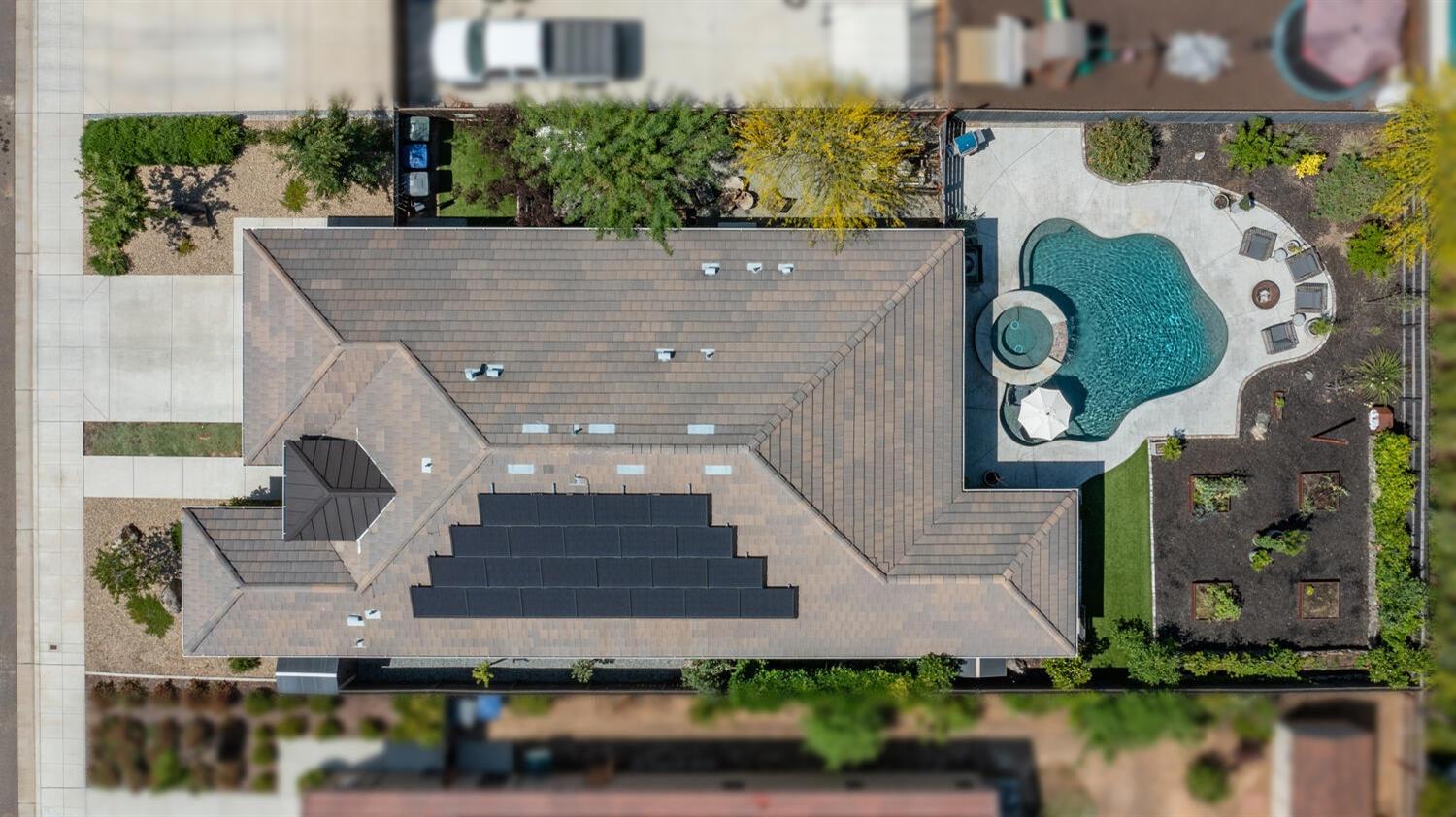 3477 Junipero Avenue Clovis, CA 93619 - Photo 39 of 39 an aerial view of a house with a yard and a large pool