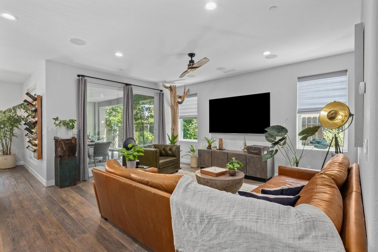 3477 Junipero Avenue Clovis, CA 93619 - Photo 8 of 39 a living room with furniture and a flat screen tv