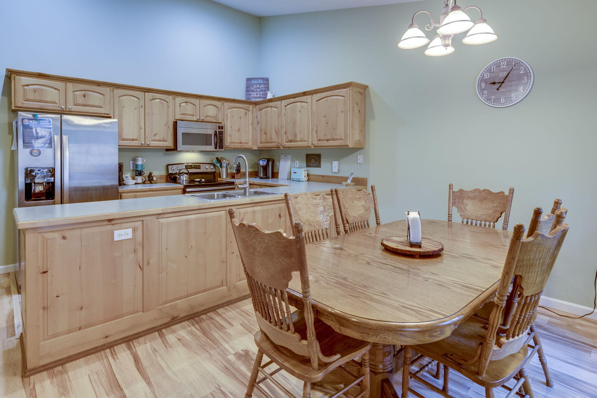 17285 Jacinto Road Bend, OR 97707 - Photo 11 of 47 a kitchen with stainless steel appliances granite countertop a kitchen island a stove a table and chairs in it