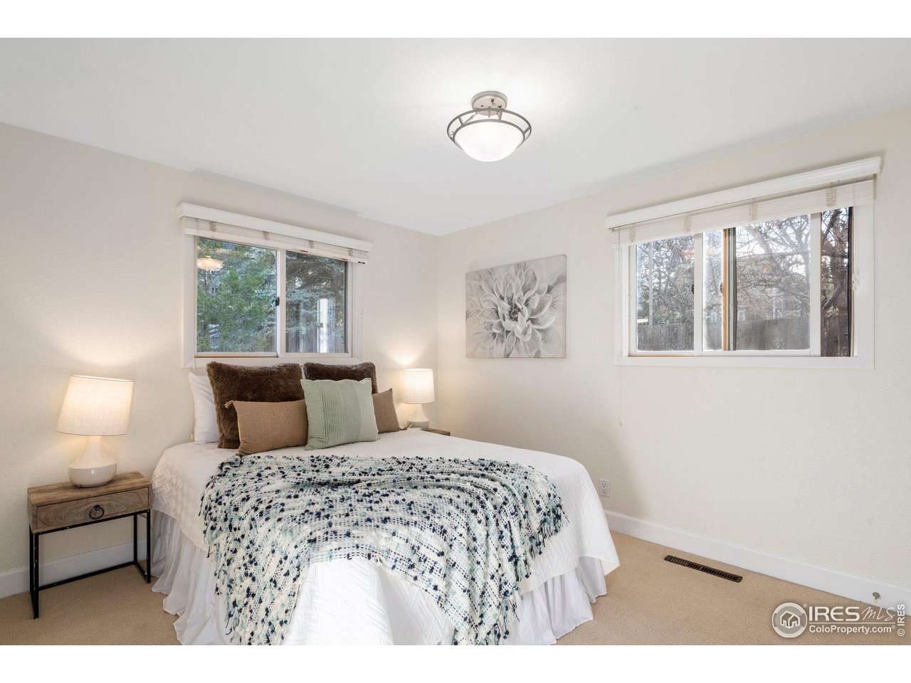 1490 Periwinkle Drive Boulder, CO 80304 - Photo 14 of 25 a bedroom with a large bed and a window