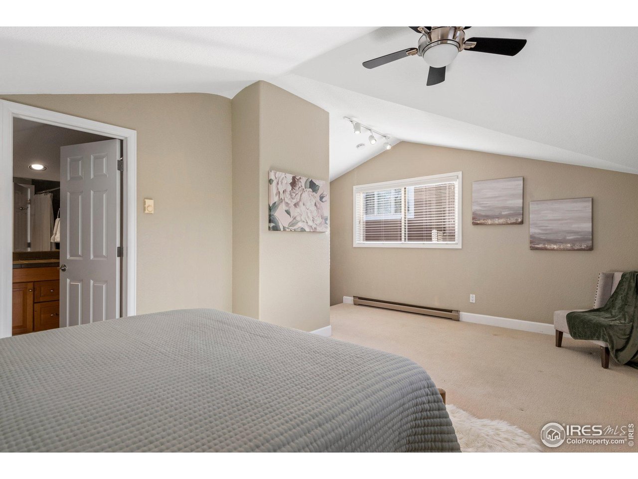 1490 Periwinkle Drive Boulder, CO 80304 - Photo 16 of 25 a bedroom with a bed and a chandelier