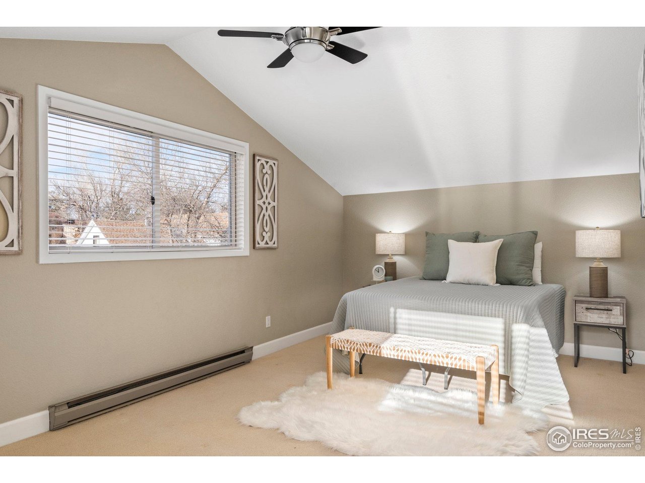 1490 Periwinkle Drive Boulder, CO 80304 - Photo 17 of 25 a bedroom with a bed and a painting on the wall