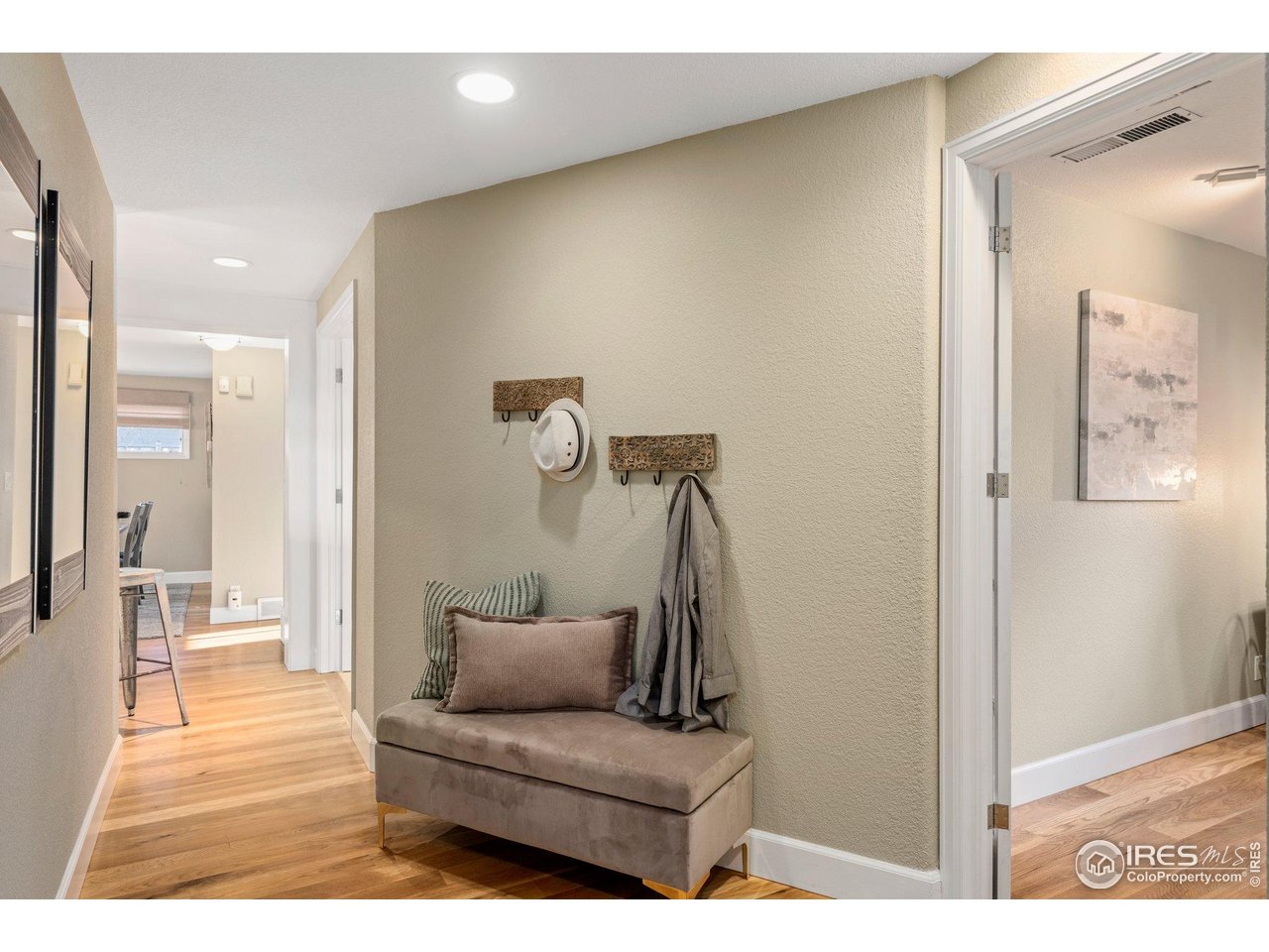 1490 Periwinkle Drive Boulder, CO 80304 - Photo 22 of 25 a living room with furniture and a wooden floor