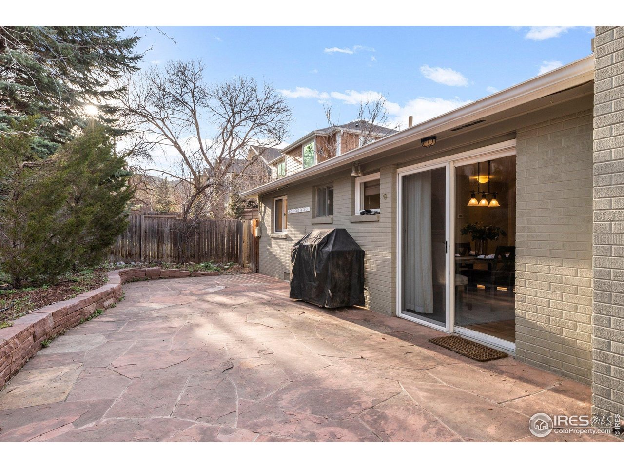 1490 Periwinkle Drive Boulder, CO 80304 - Photo 23 of 25 a view of a house with a yard and garage