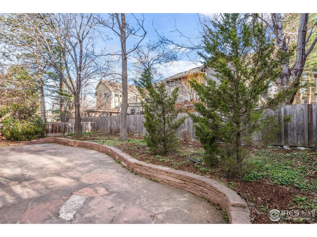 1490 Periwinkle Drive Boulder, CO 80304 - Photo 25 of 25 a backyard of a house with lots of green space