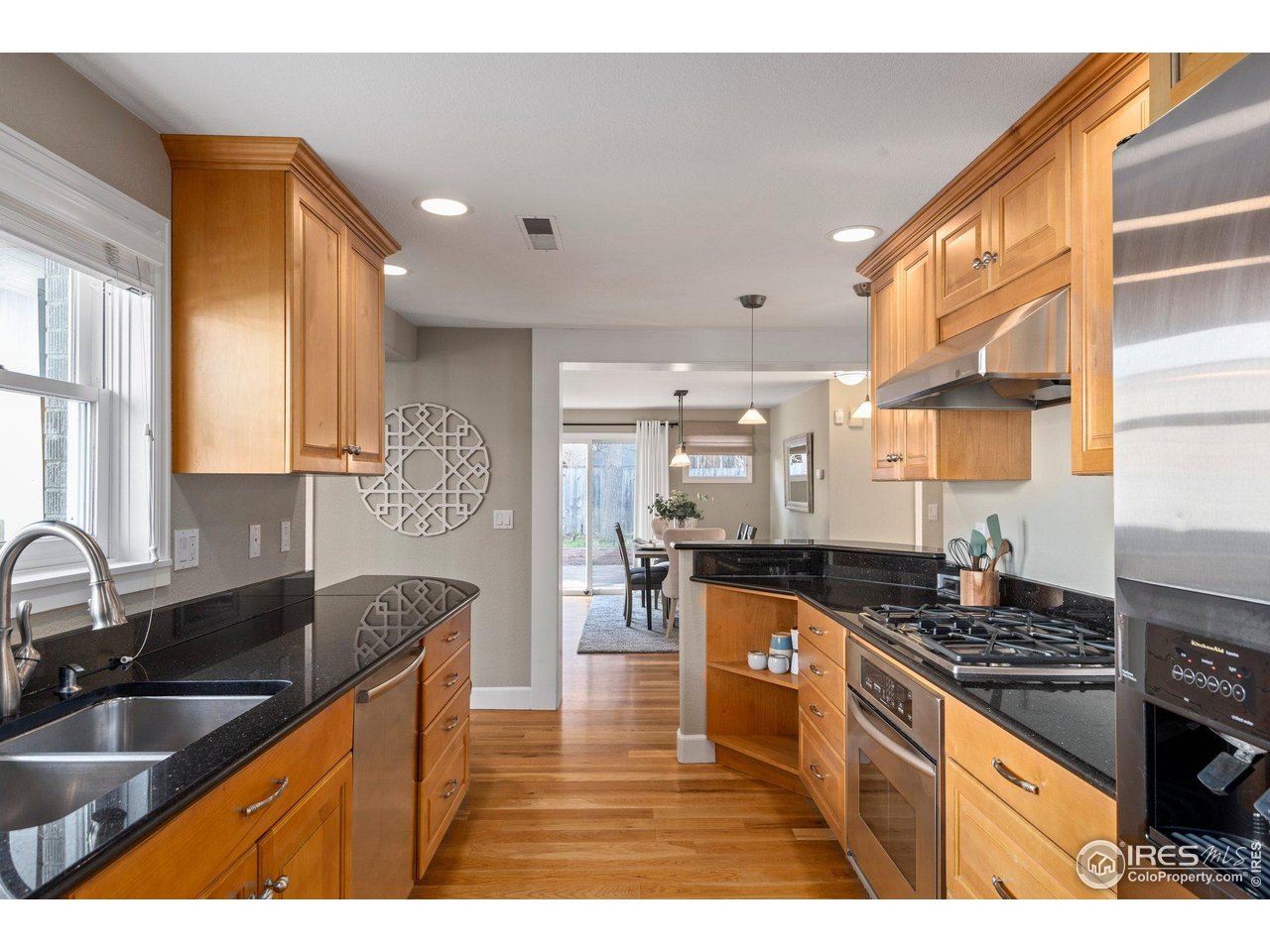 1490 Periwinkle Drive Boulder, CO 80304 - Photo 8 of 25 a kitchen with stainless steel appliances granite countertop a sink stove and cabinets