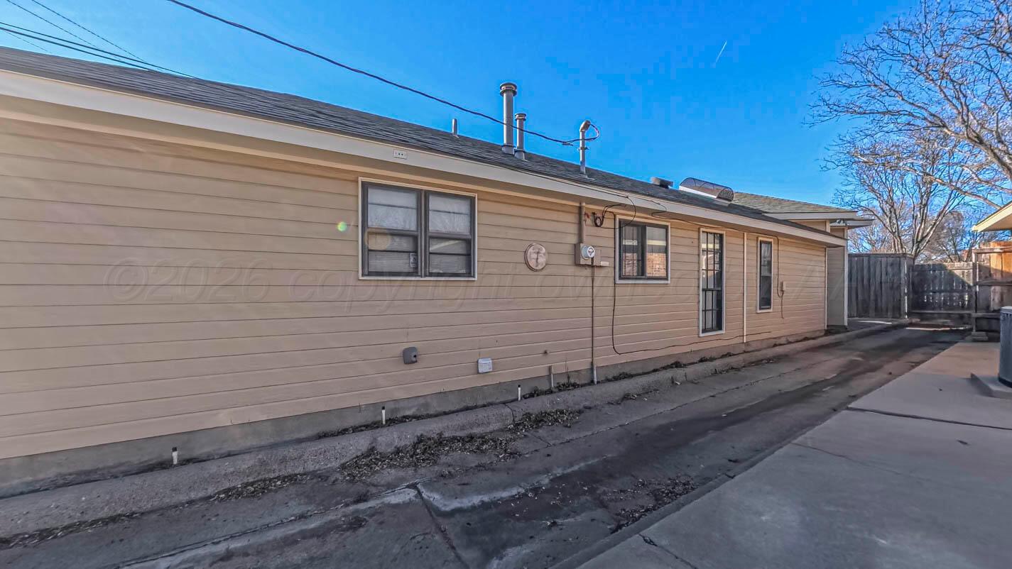 4311 Arp Place Amarillo, TX 79109 - Photo 31 of 36 a view of a house with a wooden fence