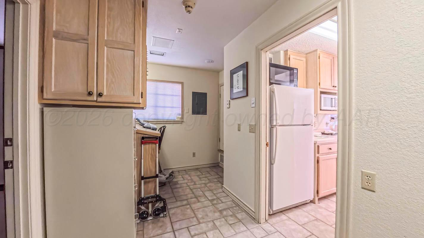 4311 Arp Place Amarillo, TX 79109 - Photo 35 of 36 a view of hallway with granite countertop furniture and a window