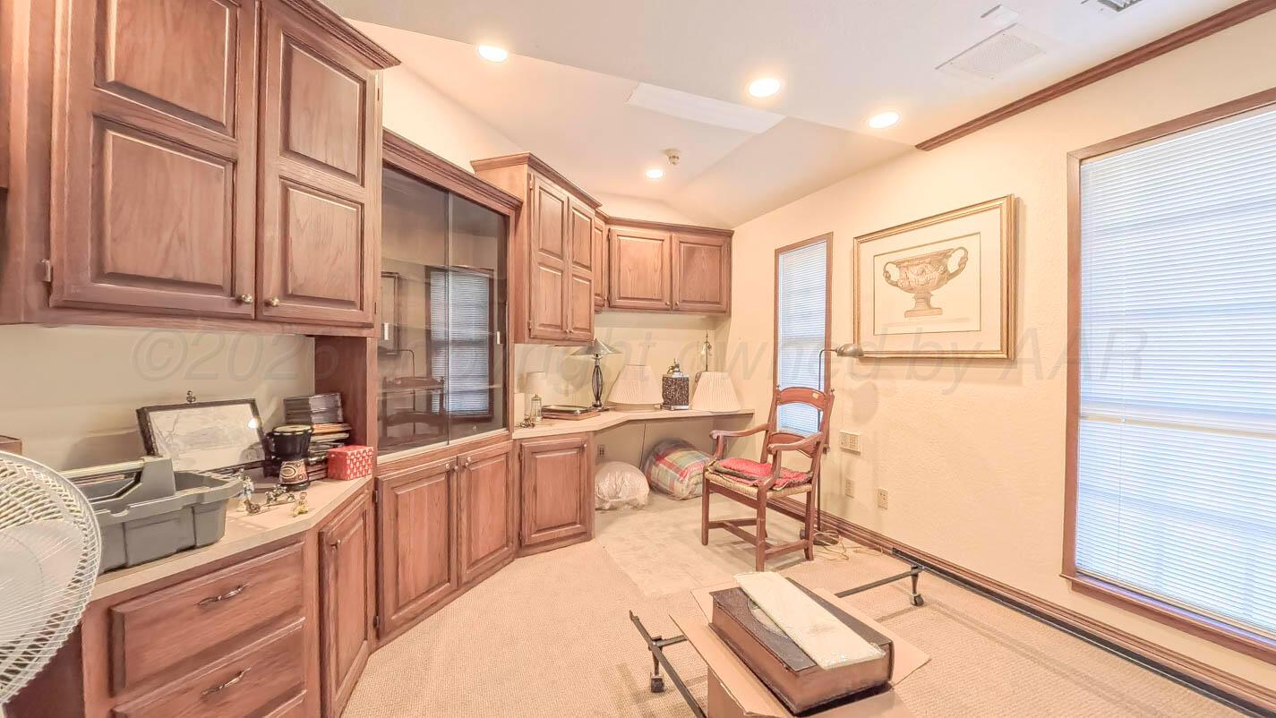 4311 Arp Place Amarillo, TX 79109 - Photo 36 of 36 a kitchen with stainless steel appliances granite countertop a sink stove and cabinets