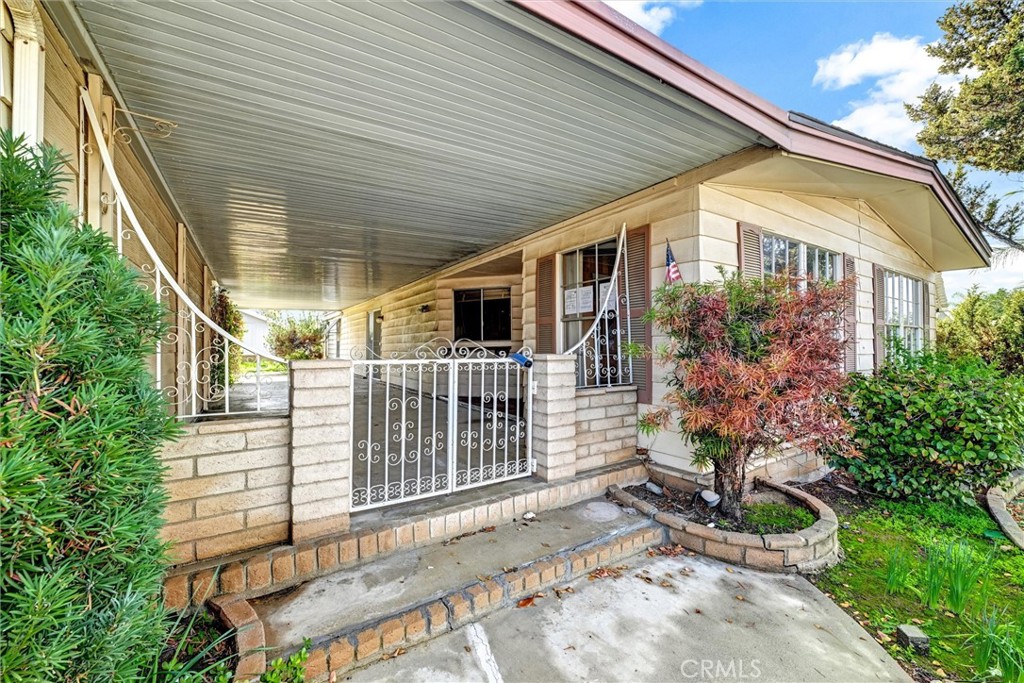 1348 Jasmine Way Hemet, CA 92545 - Photo 6 of 33 a view of a house with a yard and potted plants
