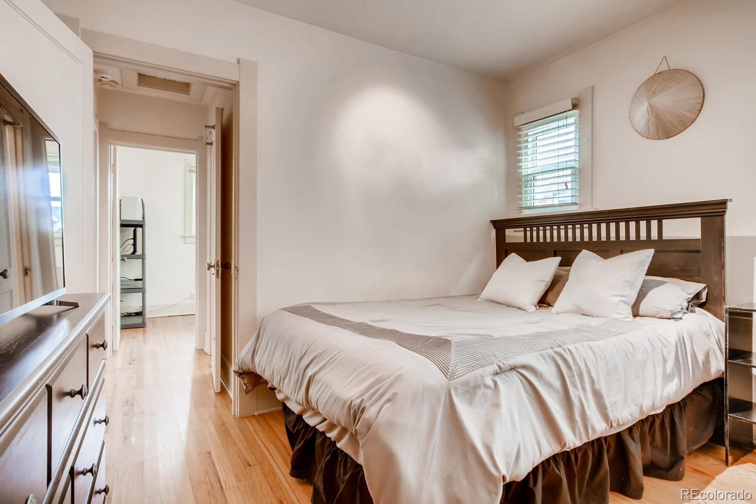 777 South Sherman Street Denver, CO 80209 - Photo 14 of 35 a bedroom with a bed and a window