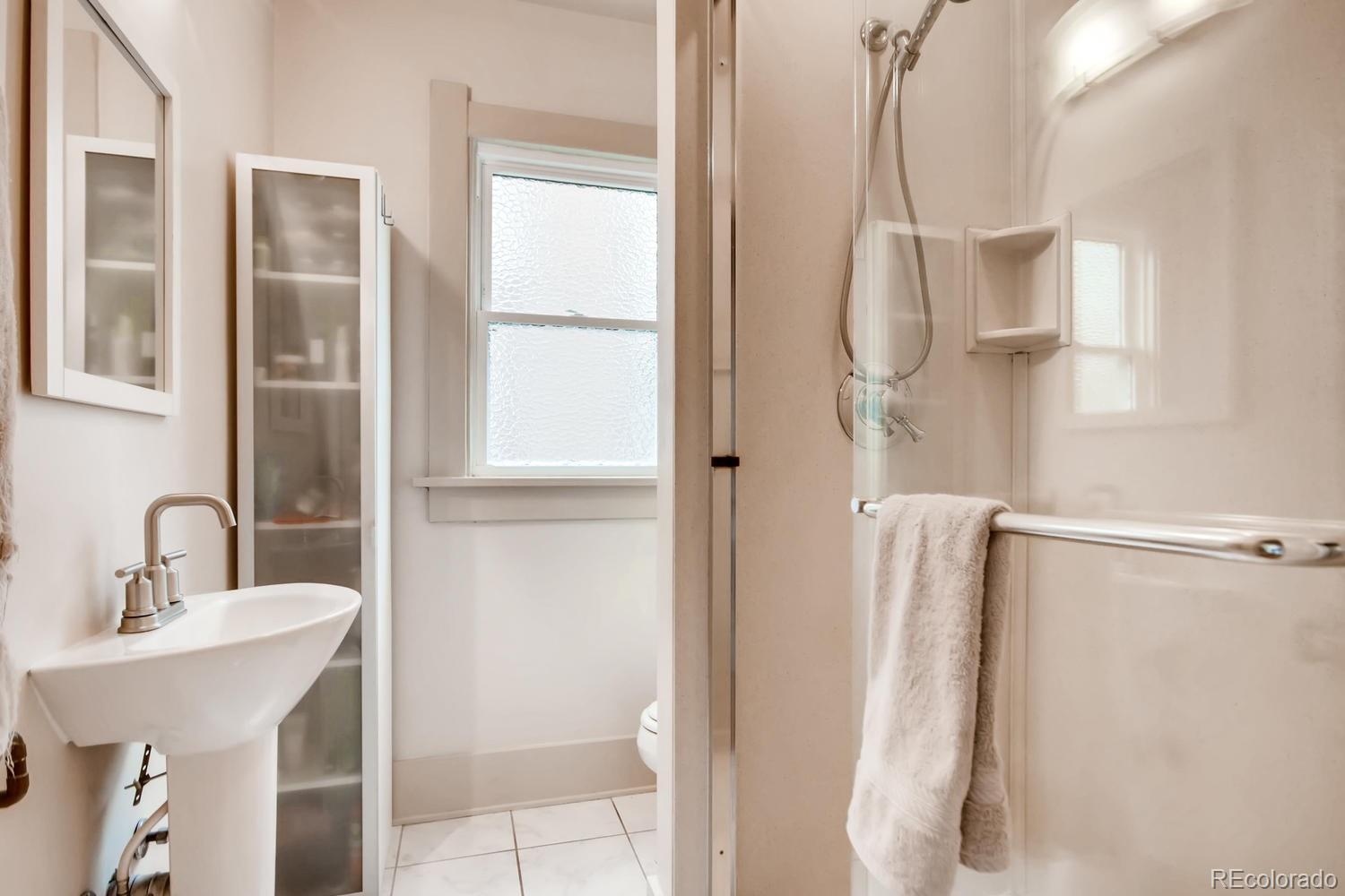 777 South Sherman Street Denver, CO 80209 - Photo 16 of 35 a bathroom with a sink vanity and a mirror