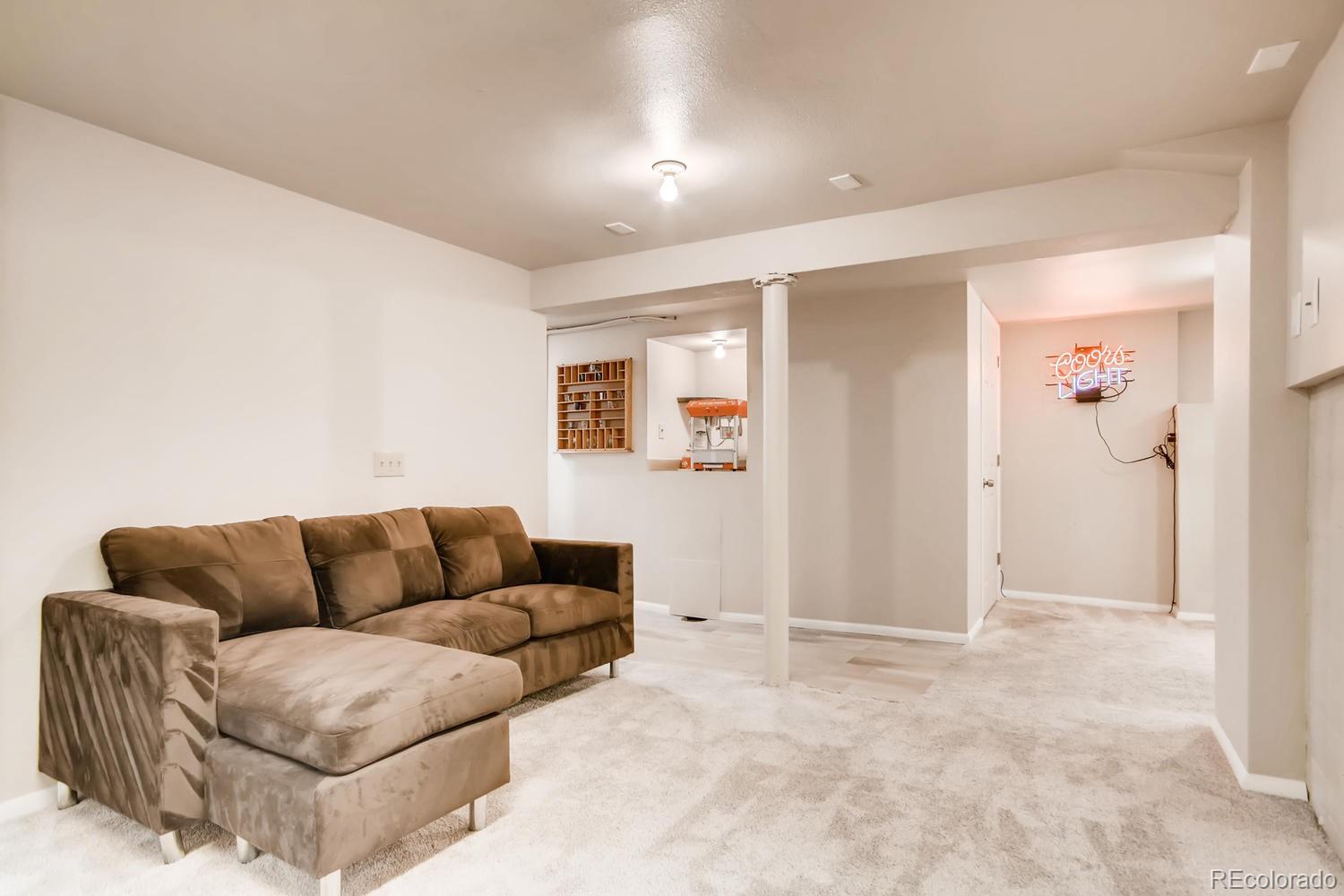 777 South Sherman Street Denver, CO 80209 - Photo 18 of 35 a living room with furniture a couch and a window