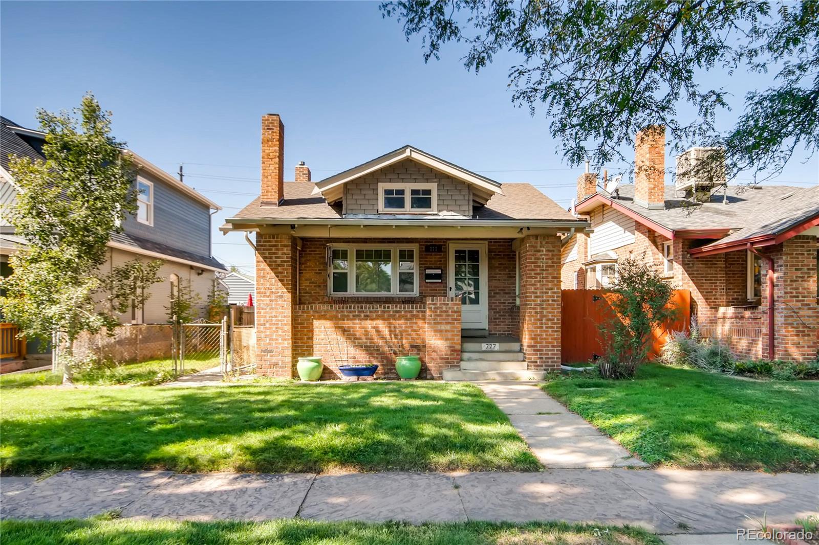 777 South Sherman Street Denver, CO 80209 - Photo 2 of 35 a front view of a house with garden