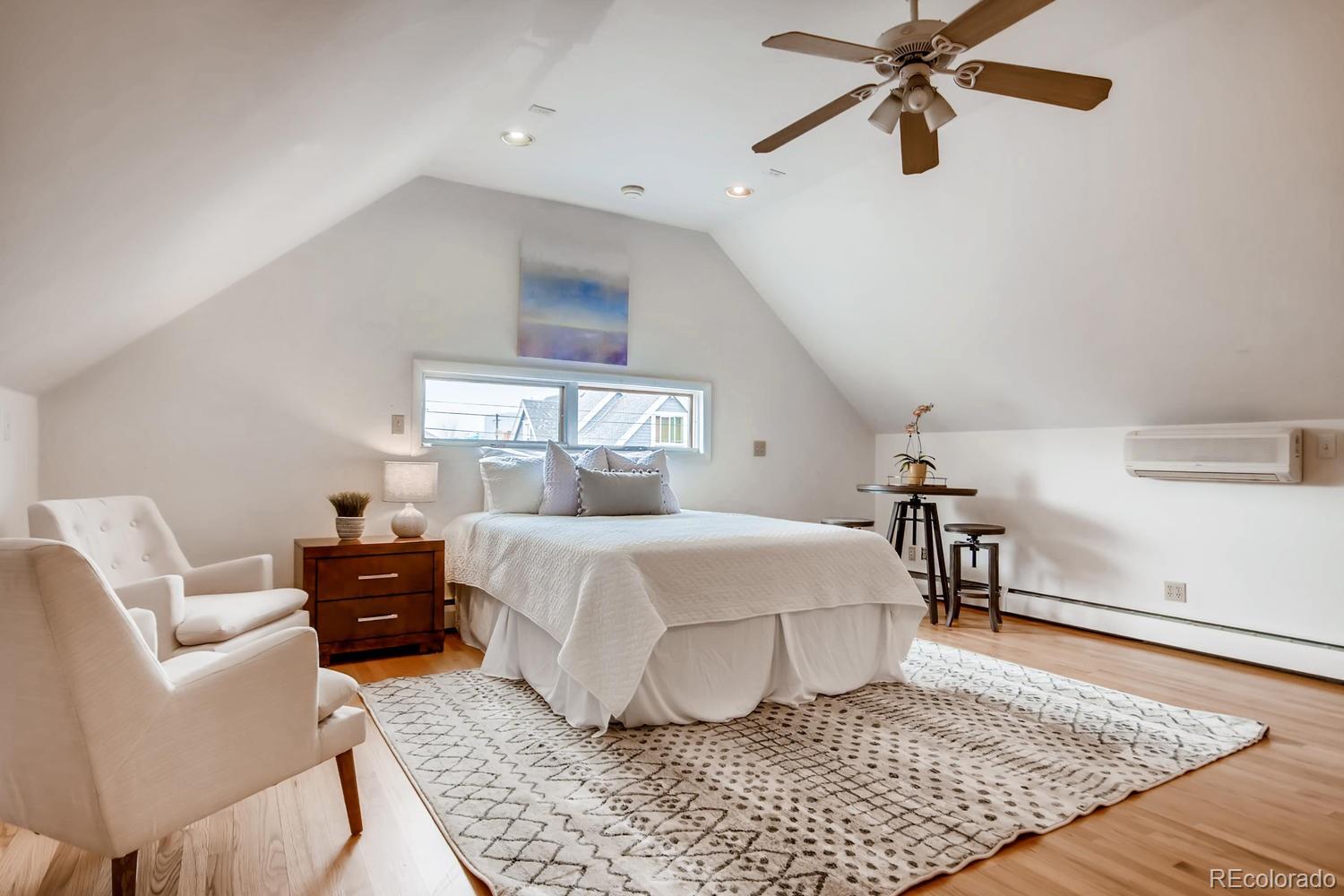 777 South Sherman Street Denver, CO 80209 - Photo 22 of 35 a bedroom with a bed and wooden floor