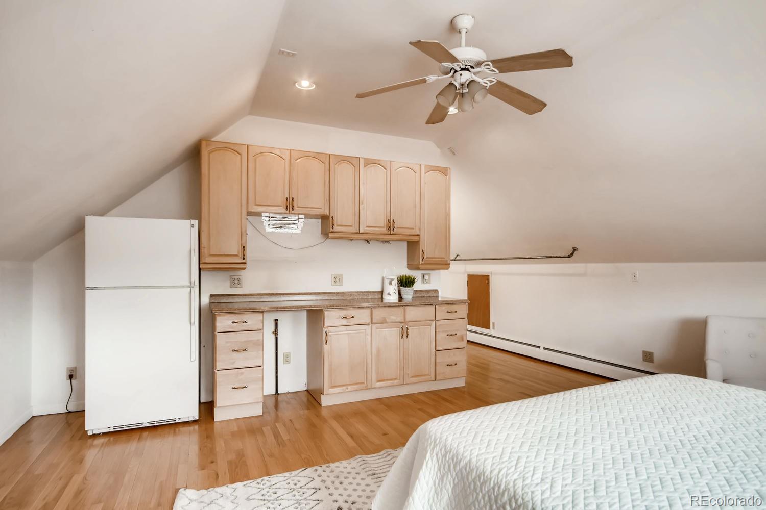 777 South Sherman Street Denver, CO 80209 - Photo 24 of 35 a bedroom with a bed and a chandelier