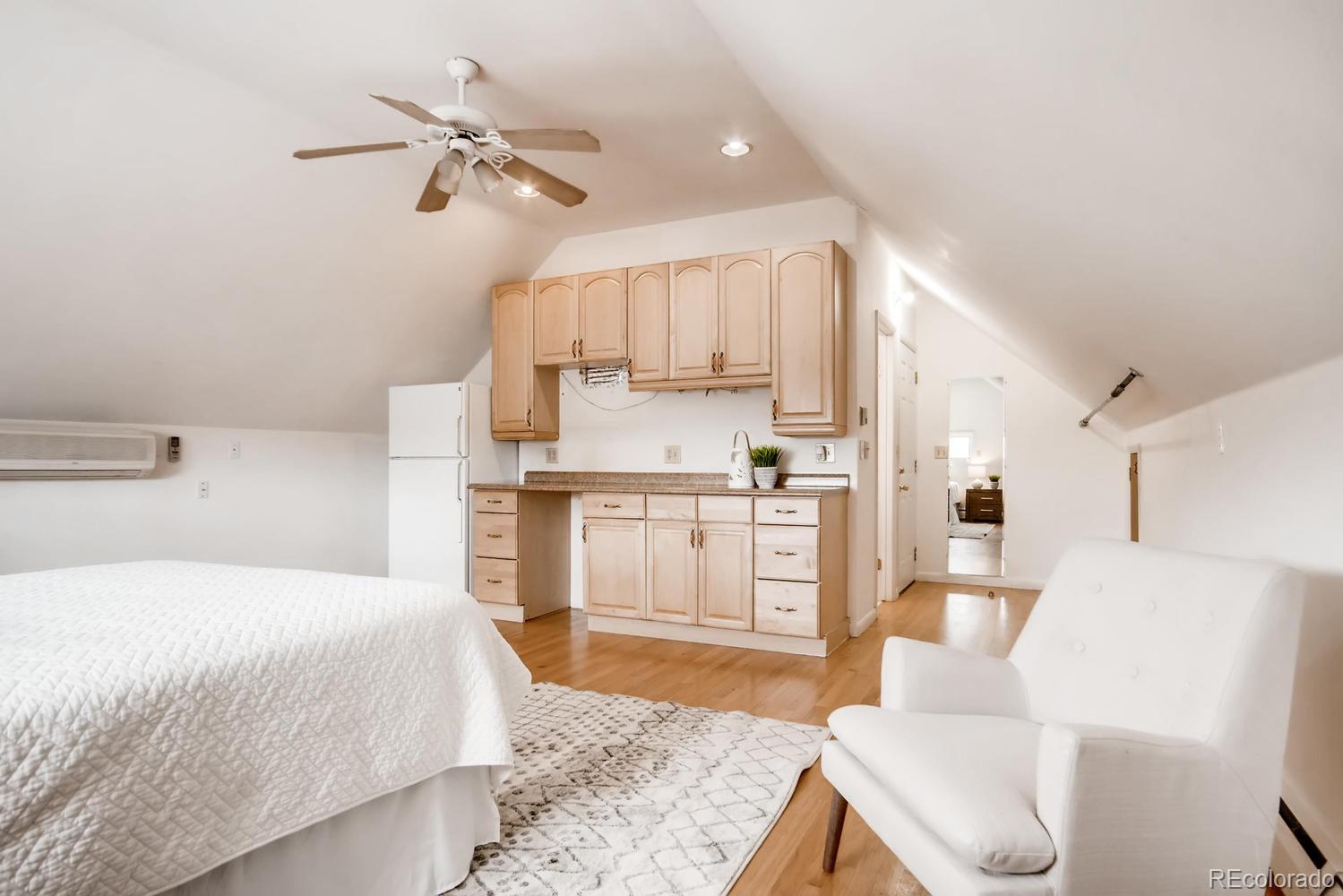 777 South Sherman Street Denver, CO 80209 - Photo 25 of 35 a spacious bedroom with a bed and a view of living room