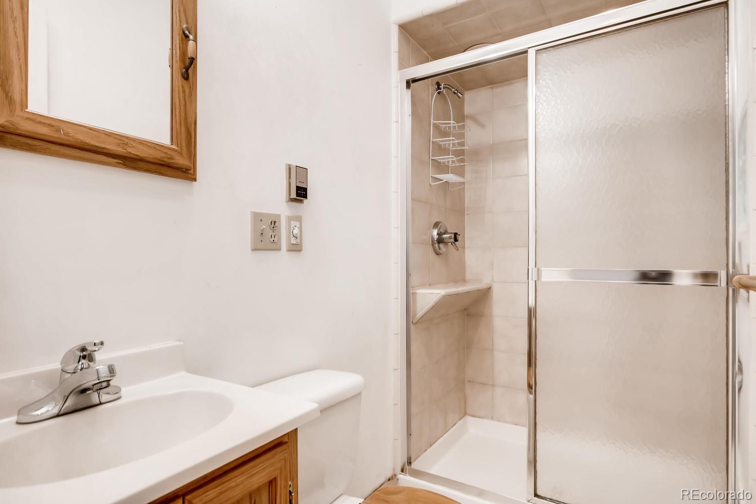 777 South Sherman Street Denver, CO 80209 - Photo 27 of 35 a bathroom with a sink and a mirror