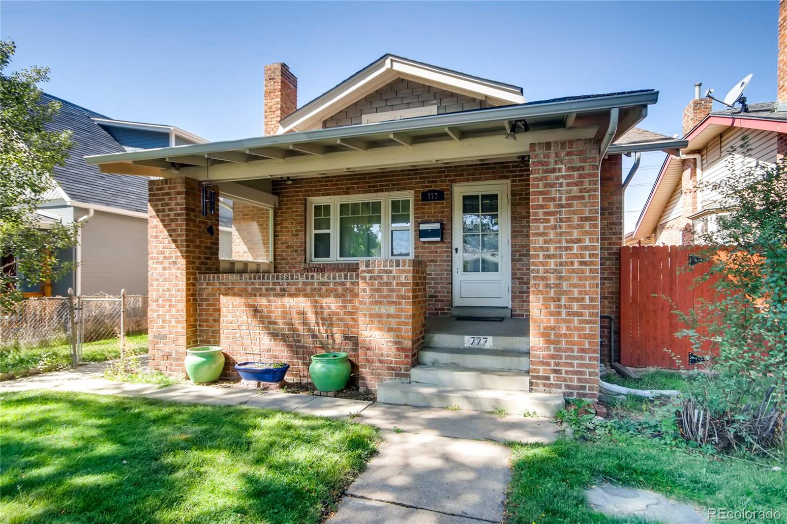 777 South Sherman Street Denver, CO 80209 - Photo 3 of 35 a front view of a house with a yard and seating space