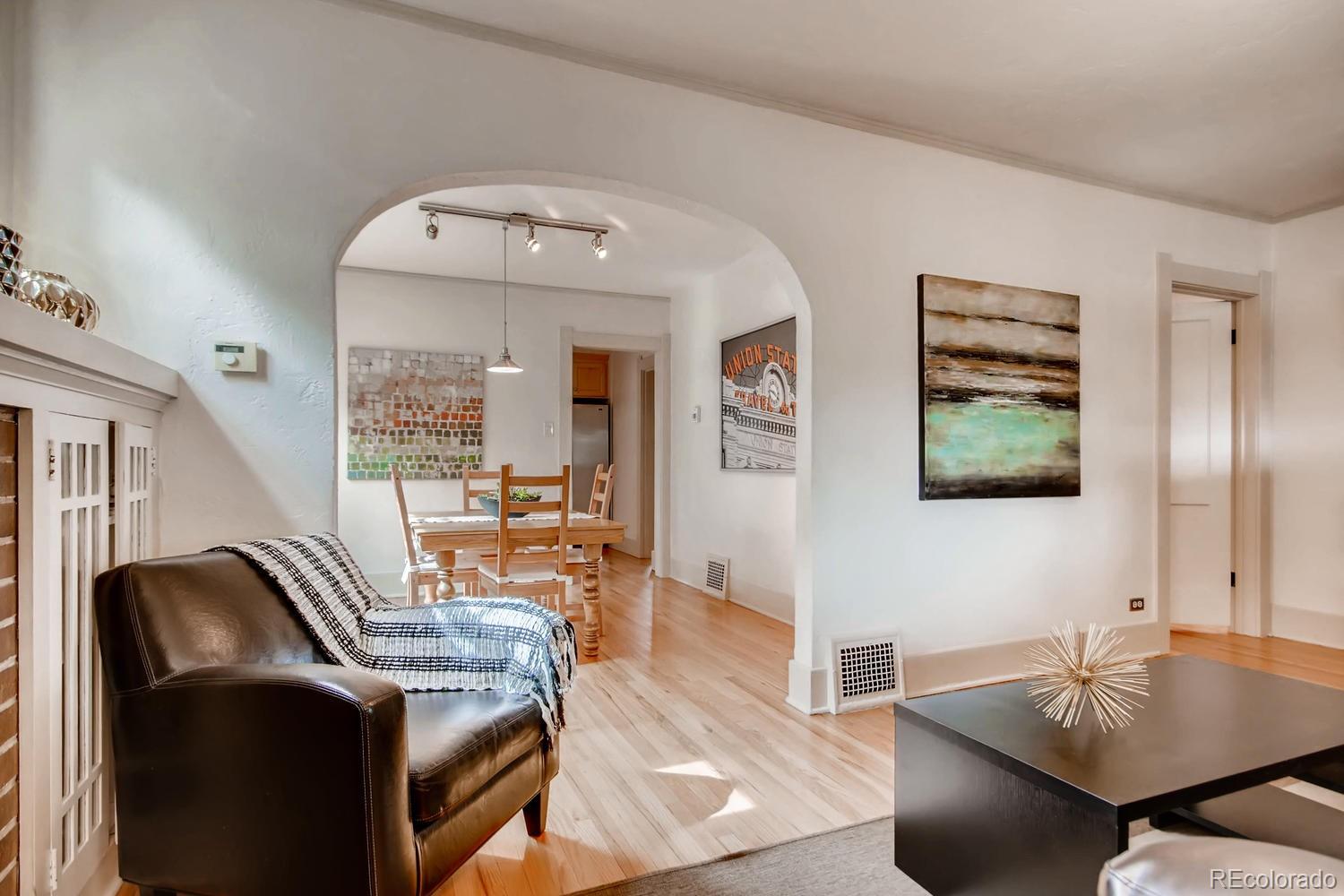 777 South Sherman Street Denver, CO 80209 - Photo 6 of 35 a living room with furniture and a flat screen tv