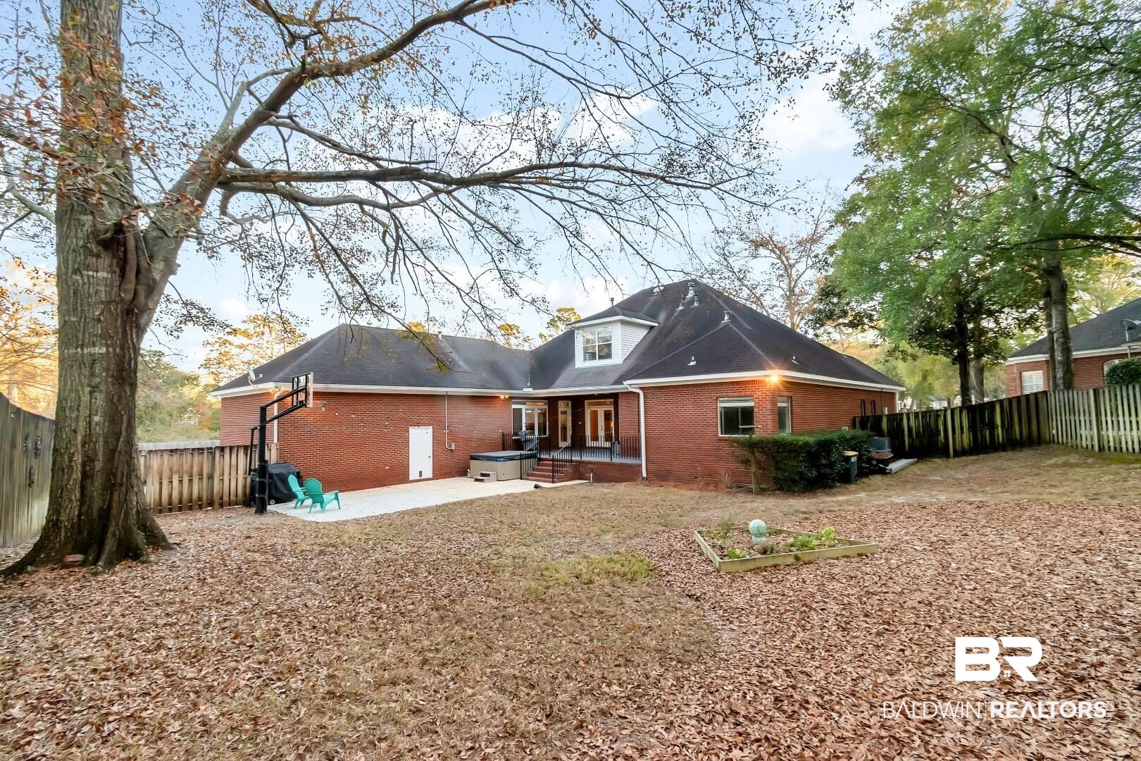 1050 Southern Way Court Mobile, AL 36609 - Photo 35 of 36 Rear view of house with a patio