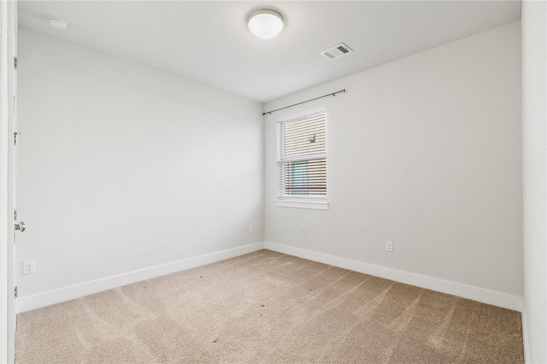 941 Del Raphael Drive Leander, TX 78641 - Photo 20 of 33 An additional secondary bedroom offers a flexible layout that works just as well for guests or a hobby space