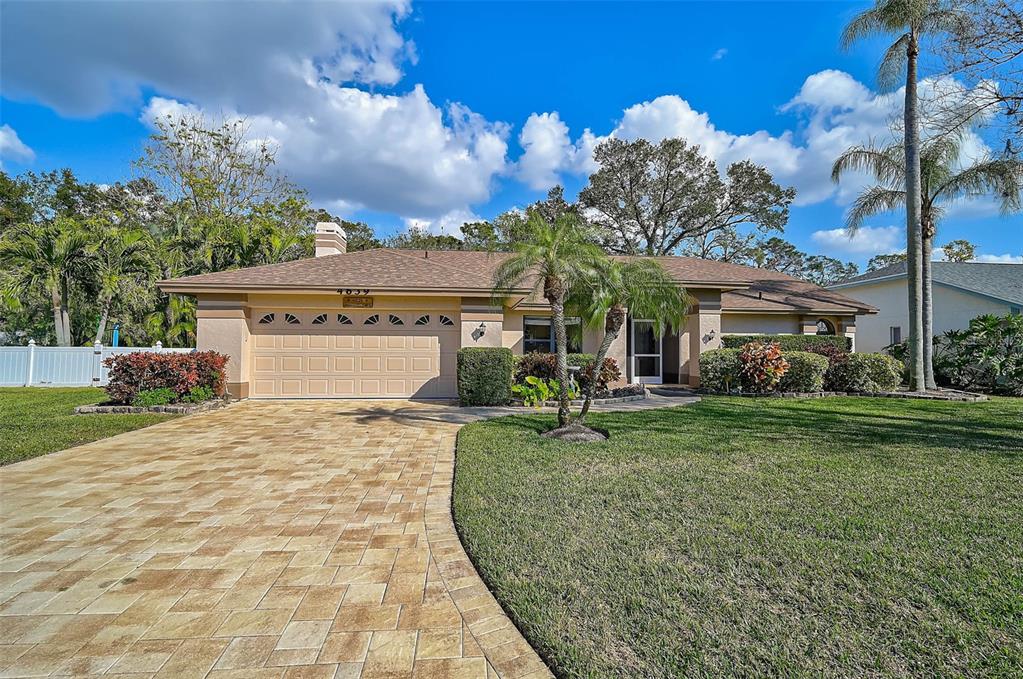 4639 Meadowview Circle Sarasota, FL 34233 - Photo 1 of 1 a front view of a house with garden
