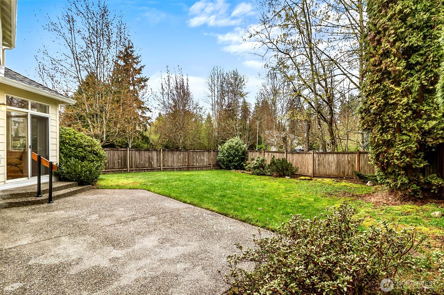 17401 33rd Drive Southeast Bothell, WA 98012 - Photo 32 of 39 a view of a backyard with potted plants and large trees