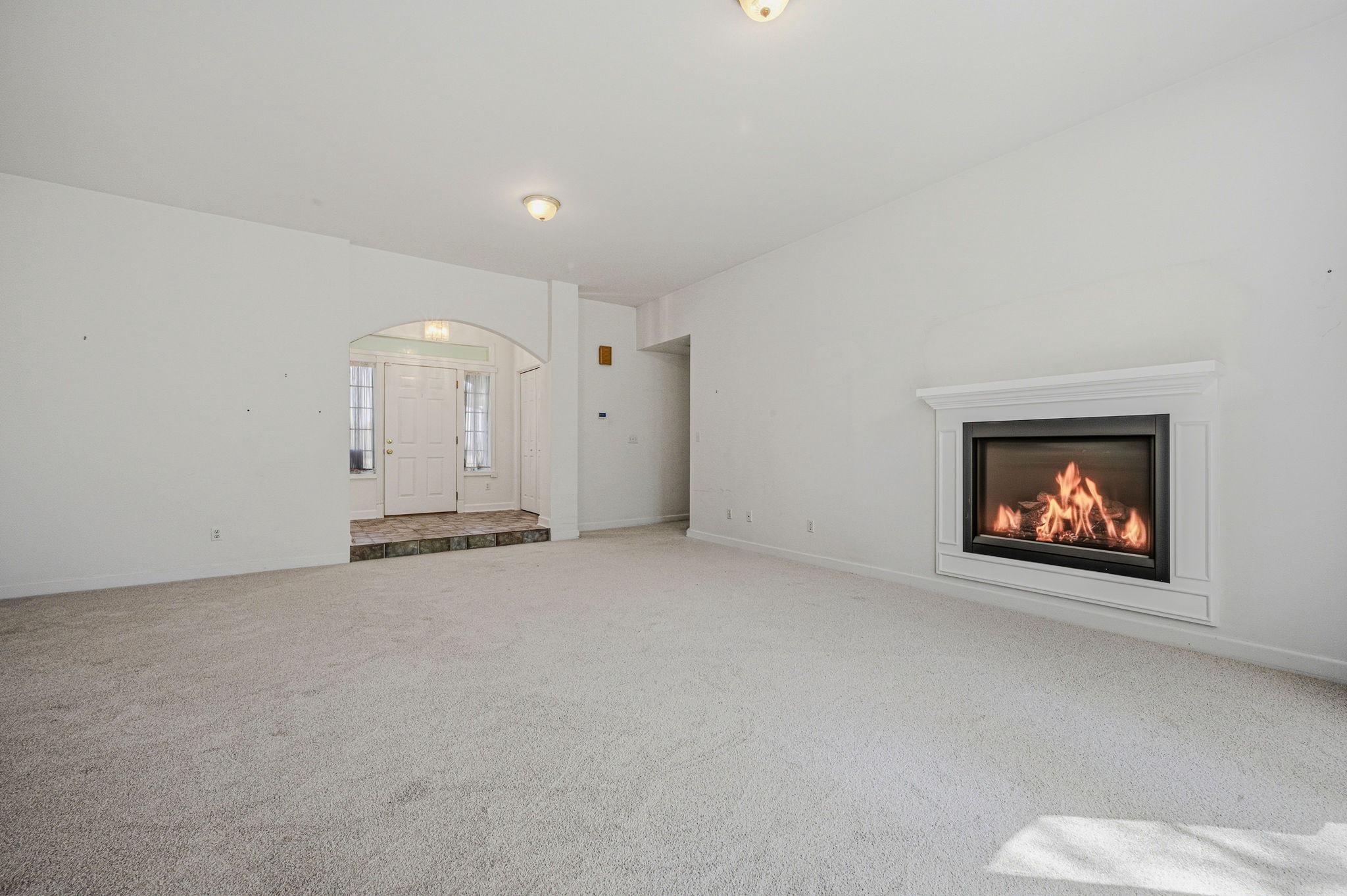 812 Taylors Bridge Road Townsend, DE 19734 - Photo 17 of 45 a view of an empty room with a fireplace